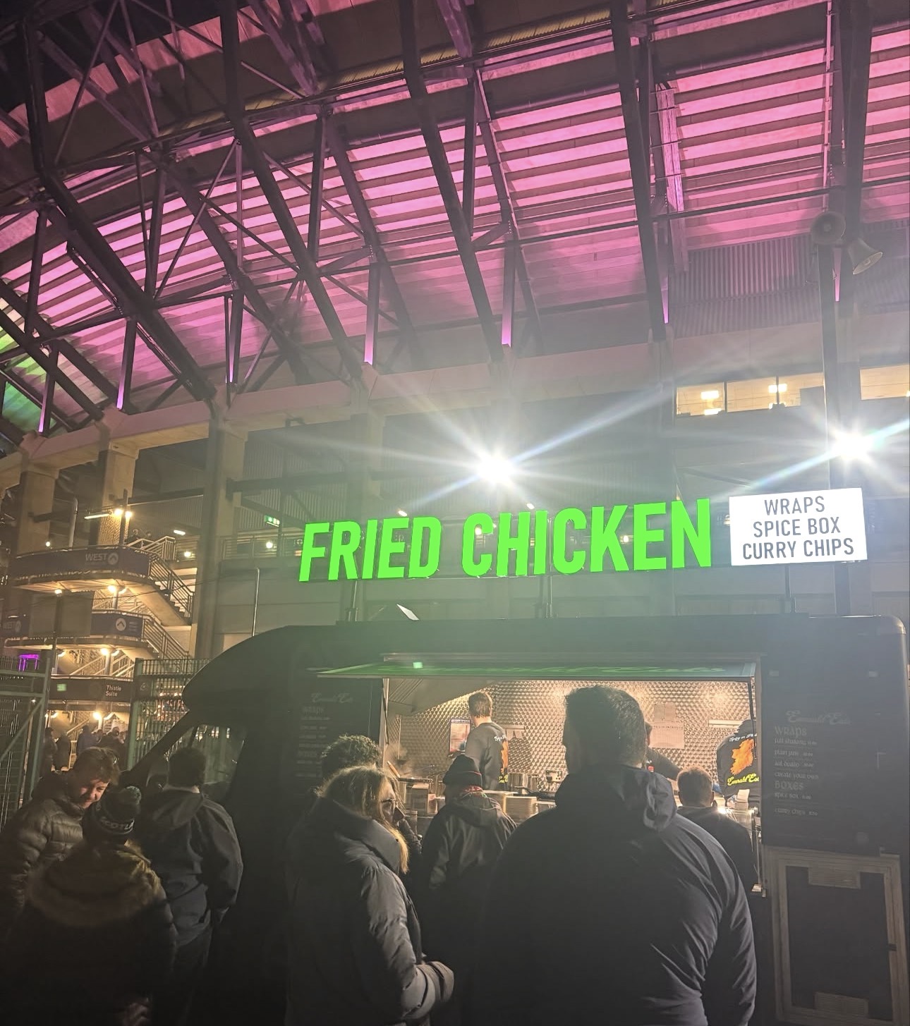Emerald Eats truck serving a crowd at a stadium